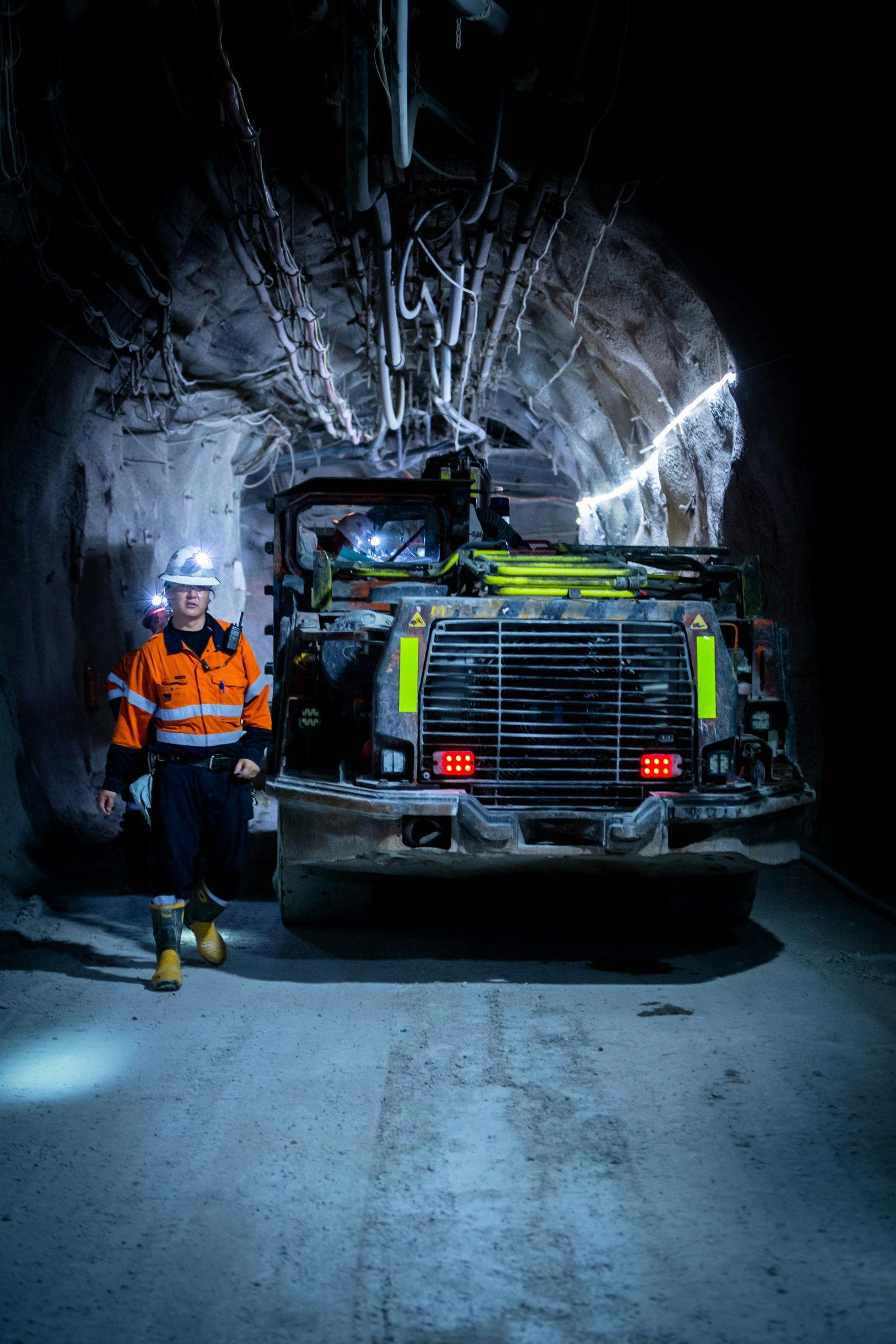 Onsite underground mining personnel in full safety gear